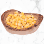 corn in a bowl on white marble counter