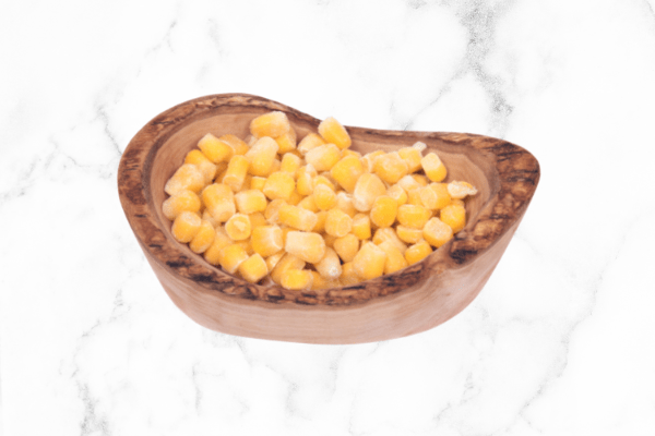 corn in a bowl on white marble counter